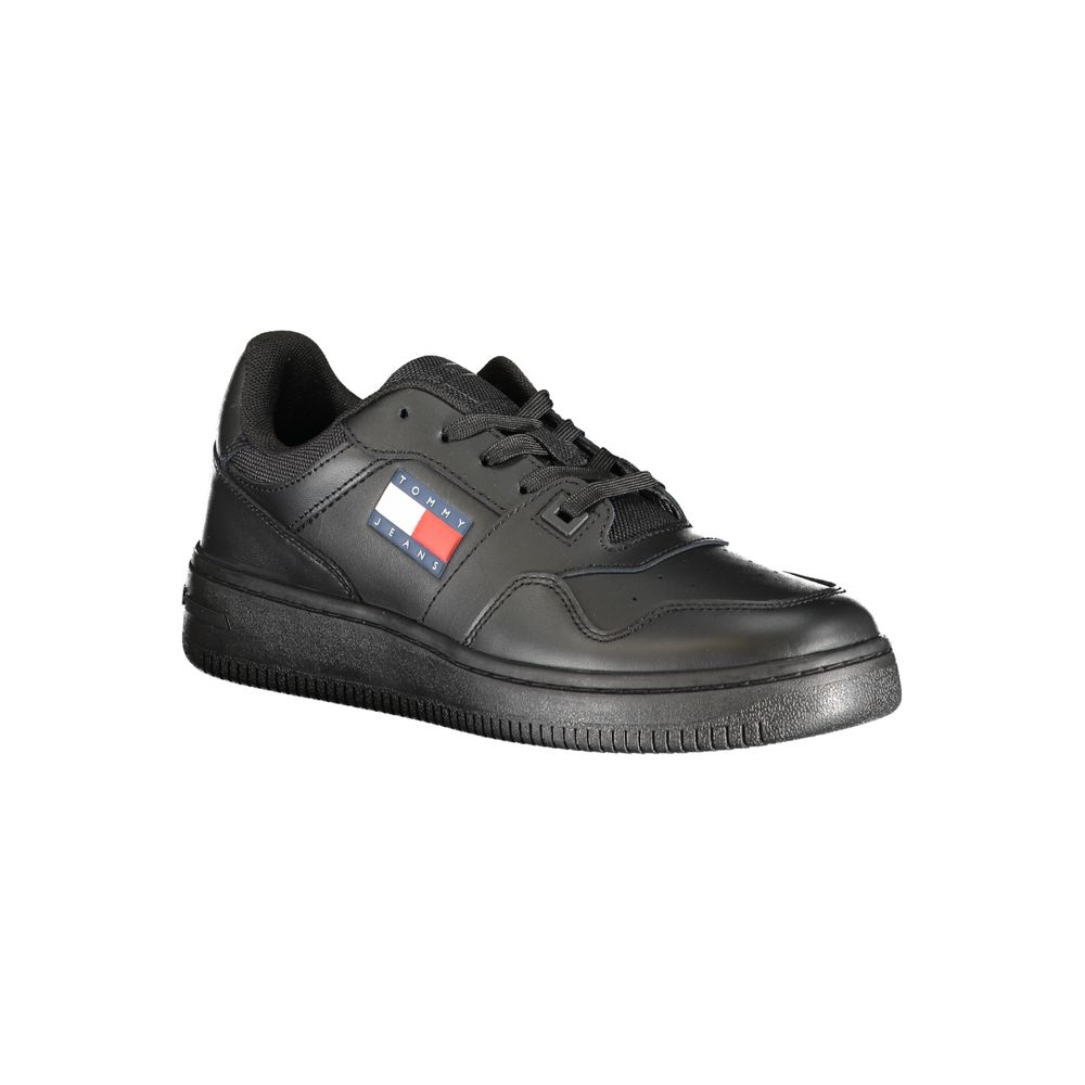 Black leather women's sneaker by Tommy Hilfiger featuring sleek design and white sole, perfect for casual wear.