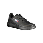 Black leather women's sneaker by Tommy Hilfiger featuring sleek design and white sole, perfect for casual wear.