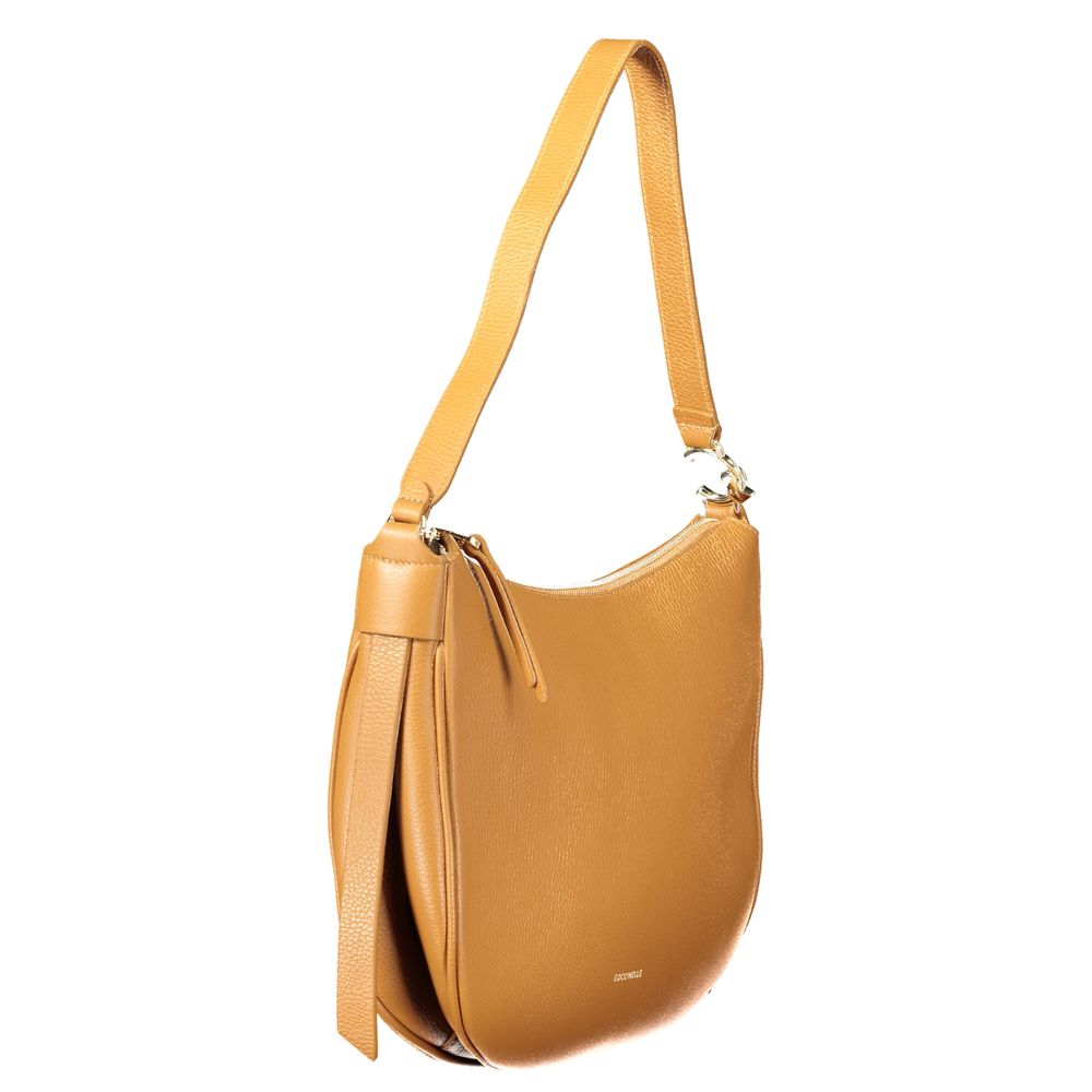 Coccinelle brown leather women’s handbag with elegant design and top handle, showcasing sophisticated craftsmanship.