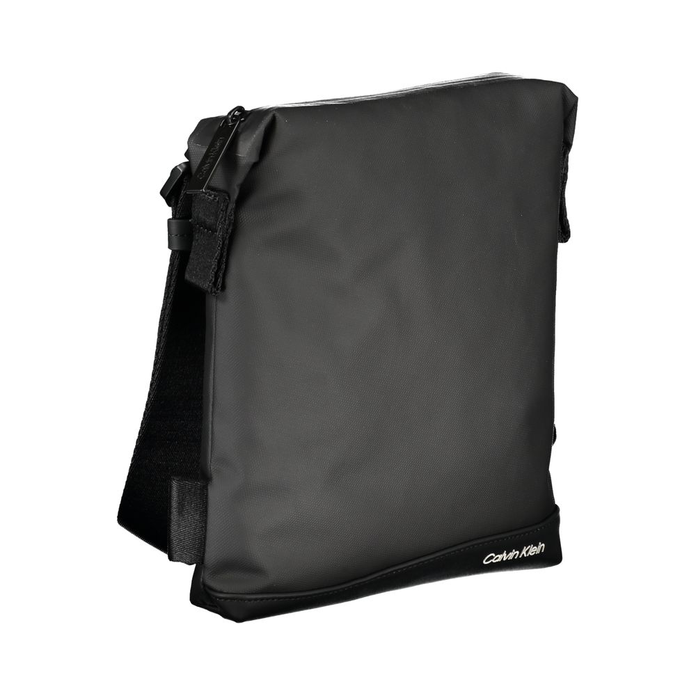 Elegant black Calvin Klein shoulder bag with contrast details, featuring a sleek design and adjustable strap.