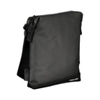 Elegant black Calvin Klein shoulder bag with contrast details, featuring a sleek design and adjustable strap.