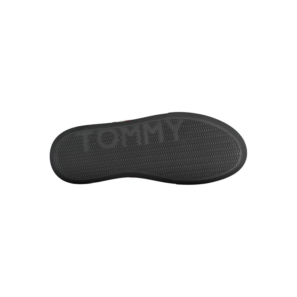 Tommy Hilfiger black leather men's sneaker showing sleek design and classic style with laces and brand logo.
