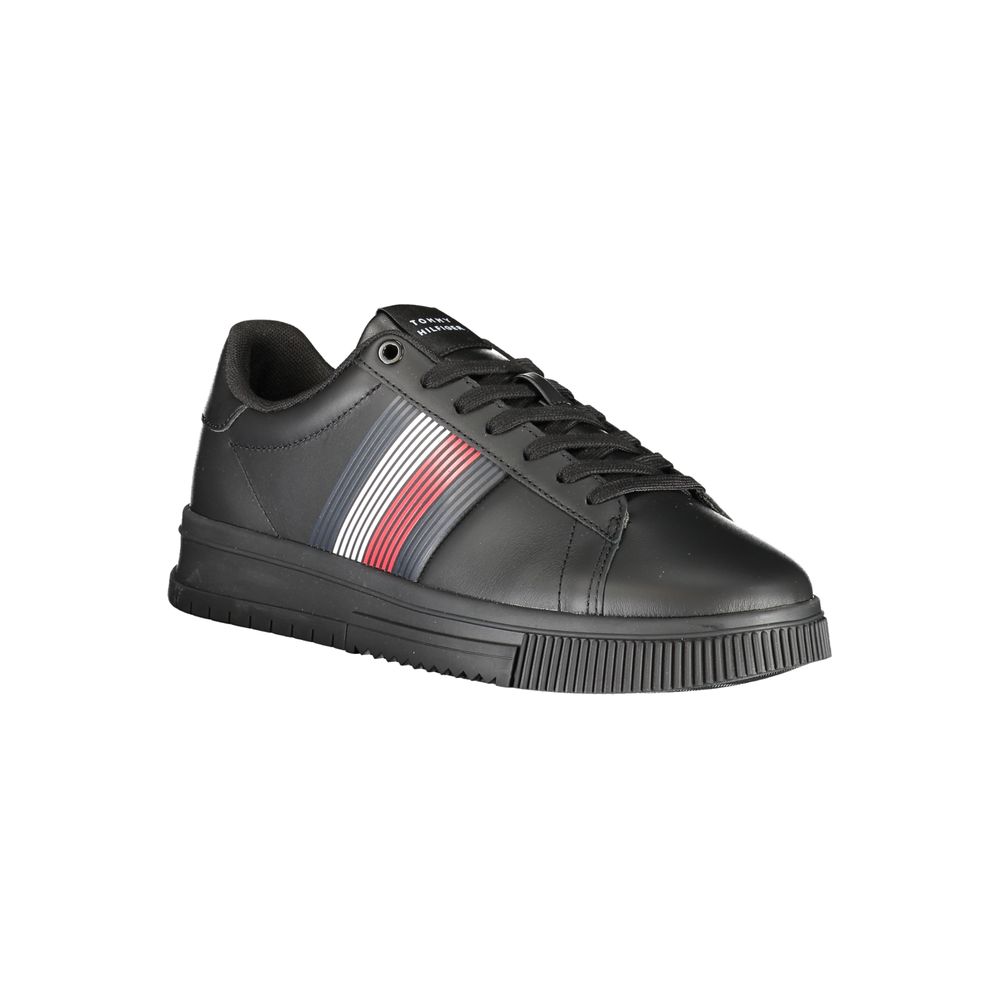 Tommy Hilfiger black polyurethane men's sneaker with white sole and brand logo detail on the side.