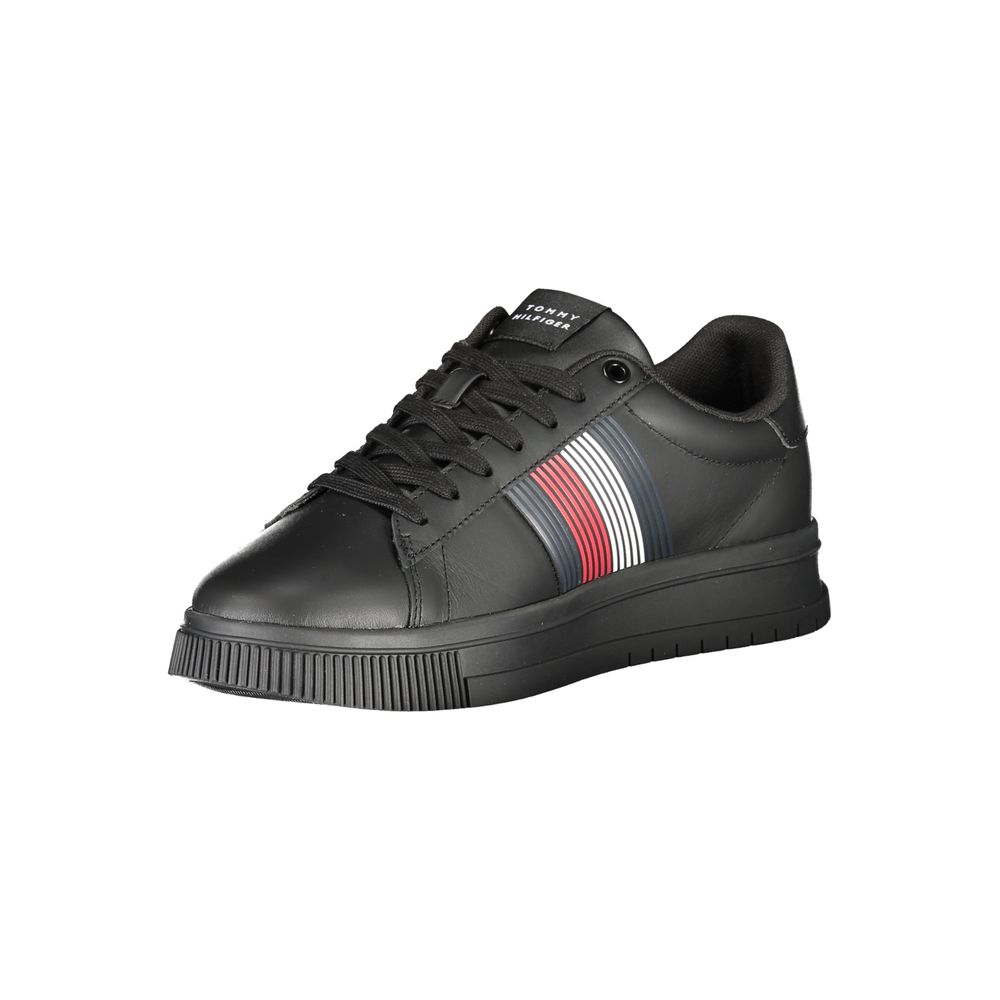 Tommy Hilfiger black polyurethane men's sneaker with white sole and logo details on the side.