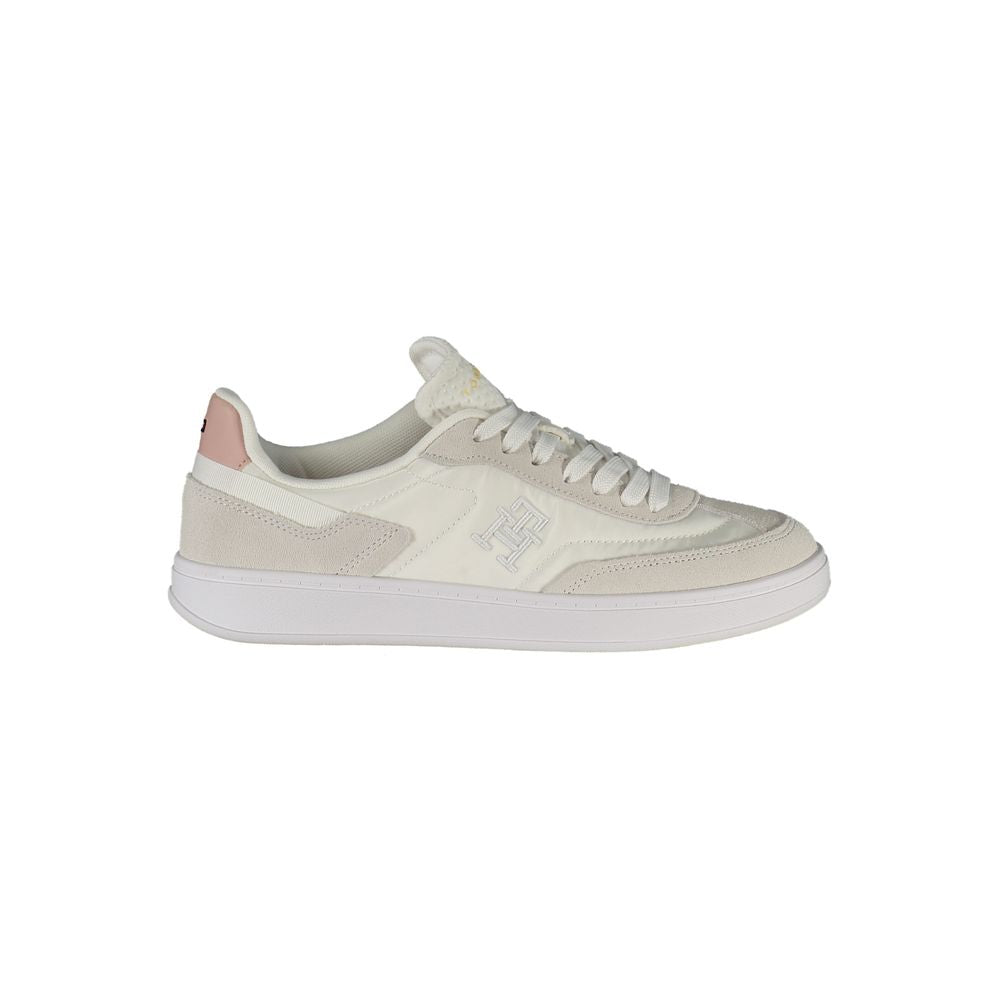 Tommy Hilfiger white polyurethane women's sneaker with a sleek design and sporty style.