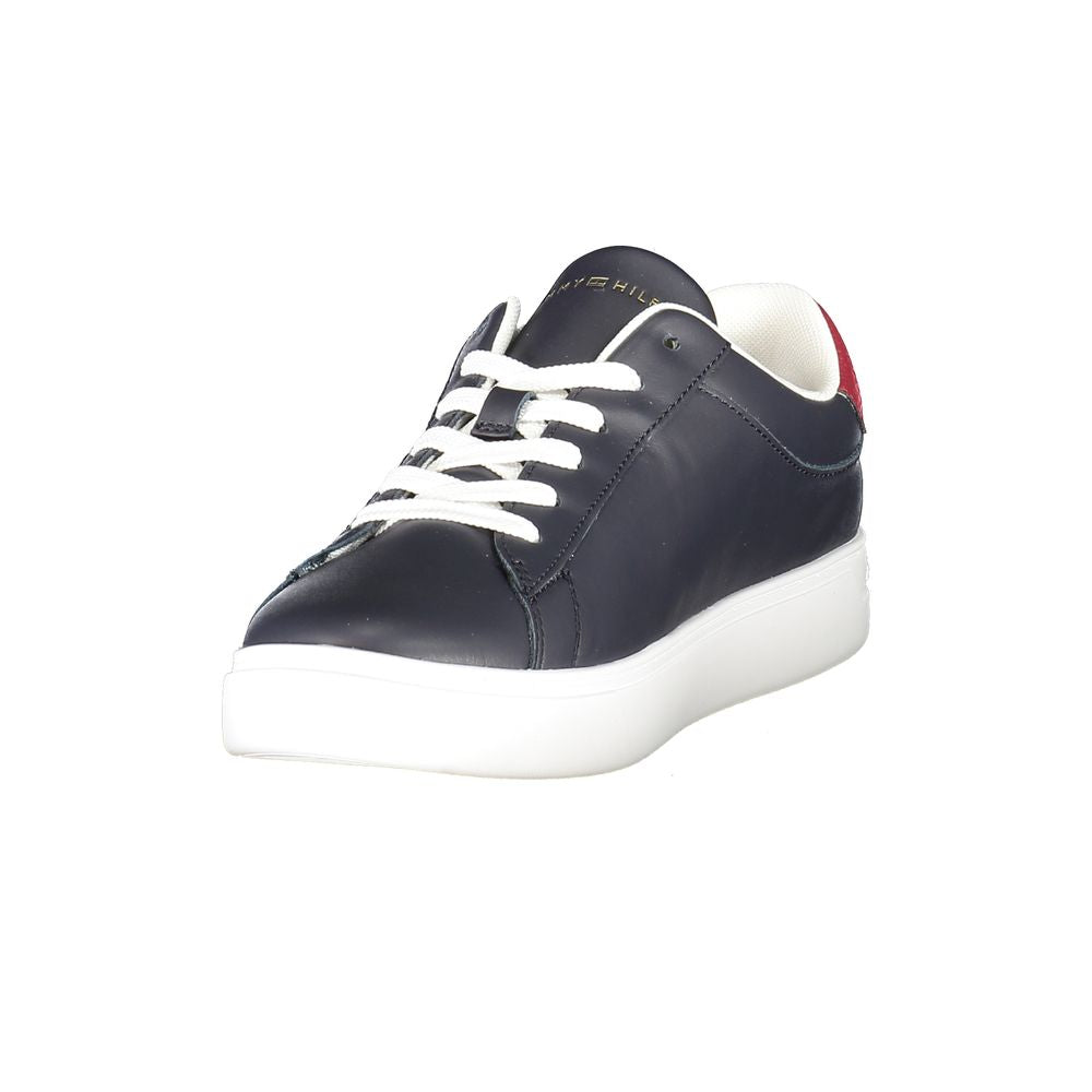 Tommy Hilfiger blue women’s sneaker with polyurethane upper, white sole, and stylish casual design.