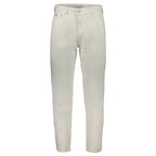 Pair of white cotton men's jeans by Calvin Klein displayed on a hanger with a plain background.