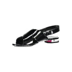Calvin Klein Nero Poliuretano women’s sandals with open toe and ankle strap, featuring sleek black design and comfortable flat sole.