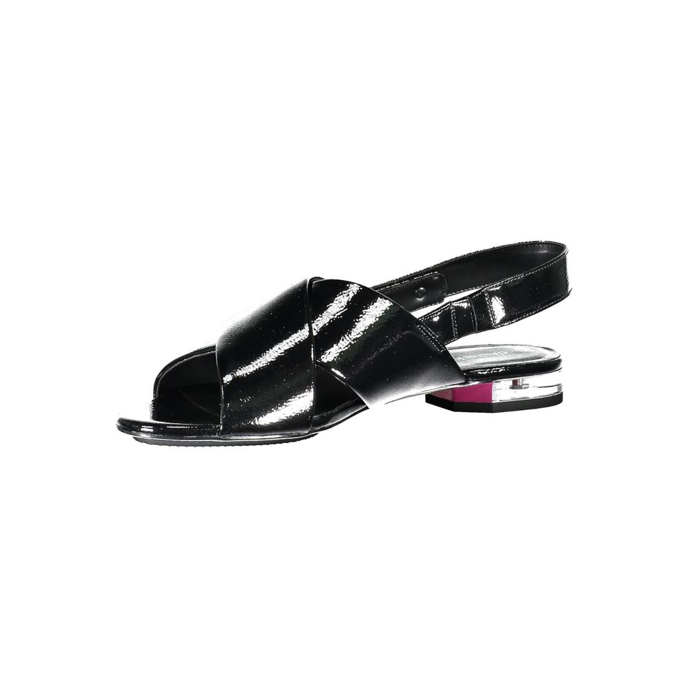 Calvin Klein Nero Poliuretano women’s sandals with open toe and ankle strap, featuring sleek black design and comfortable flat sole.