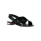 Calvin Klein Nero Poliuretano women's sandal with open toe and ankle strap, showcasing sleek black design.