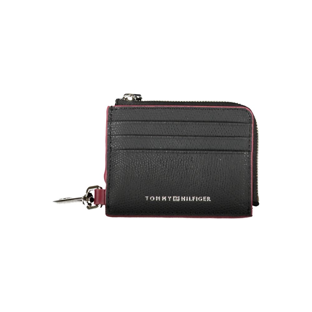 Black leather men's wallet holder by Tommy Hilfiger with sleek design and branded logo, ideal for organizing cards and cash.