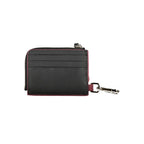Black leather men's wallet holder by Tommy Hilfiger with sleek design and multiple card slots.