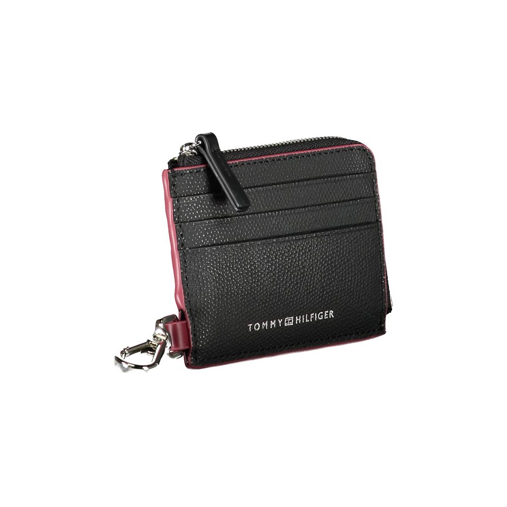 Black leather men's wallet holder by Tommy Hilfiger with sleek design and branded logo, suitable for everyday use.