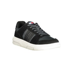 Black leather men's sneaker by Tommy Hilfiger with white sole and subtle branding, showcasing a stylish casual footwear design.
