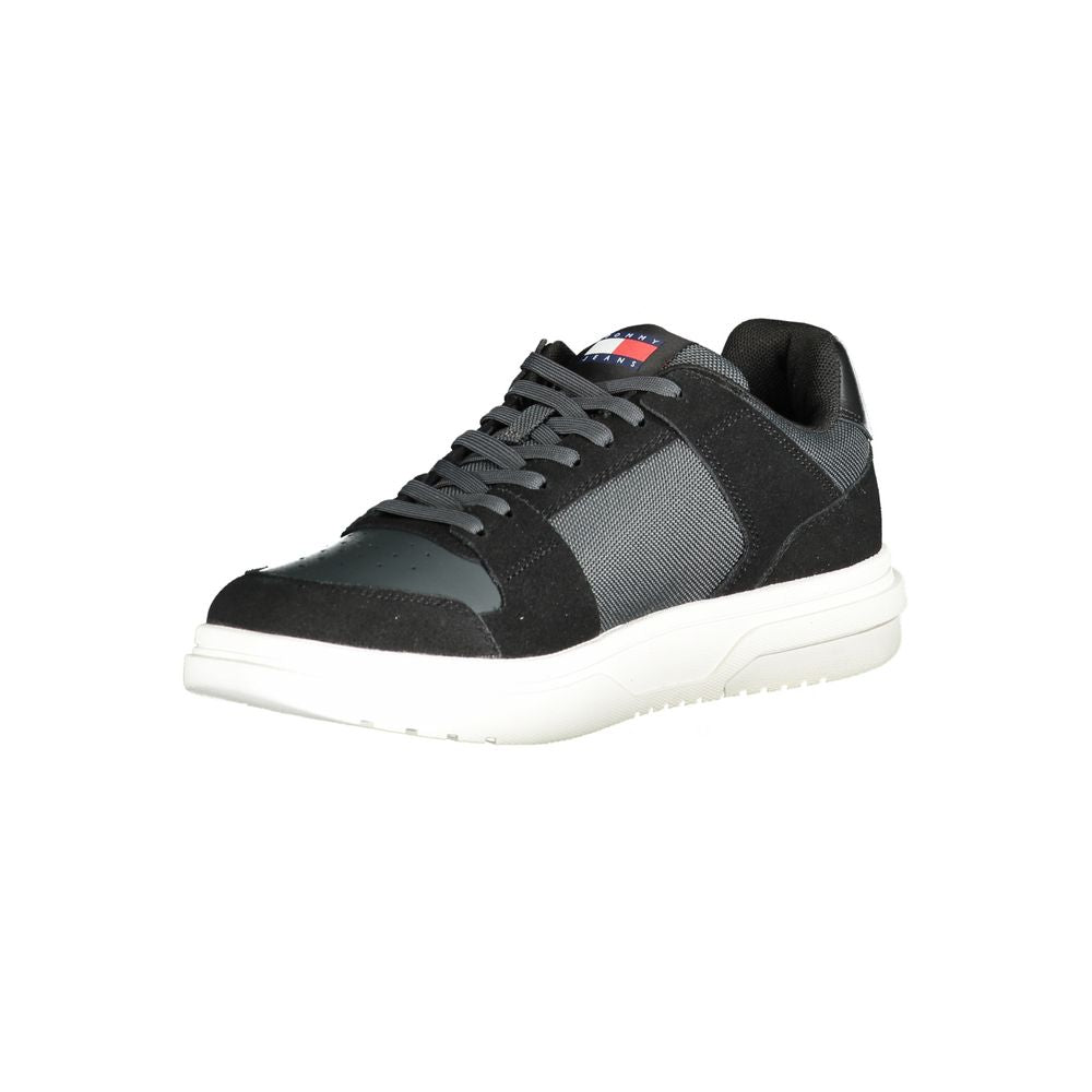 Tommy Hilfiger black leather men's sneaker with white sole and logo details, stylish casual footwear.