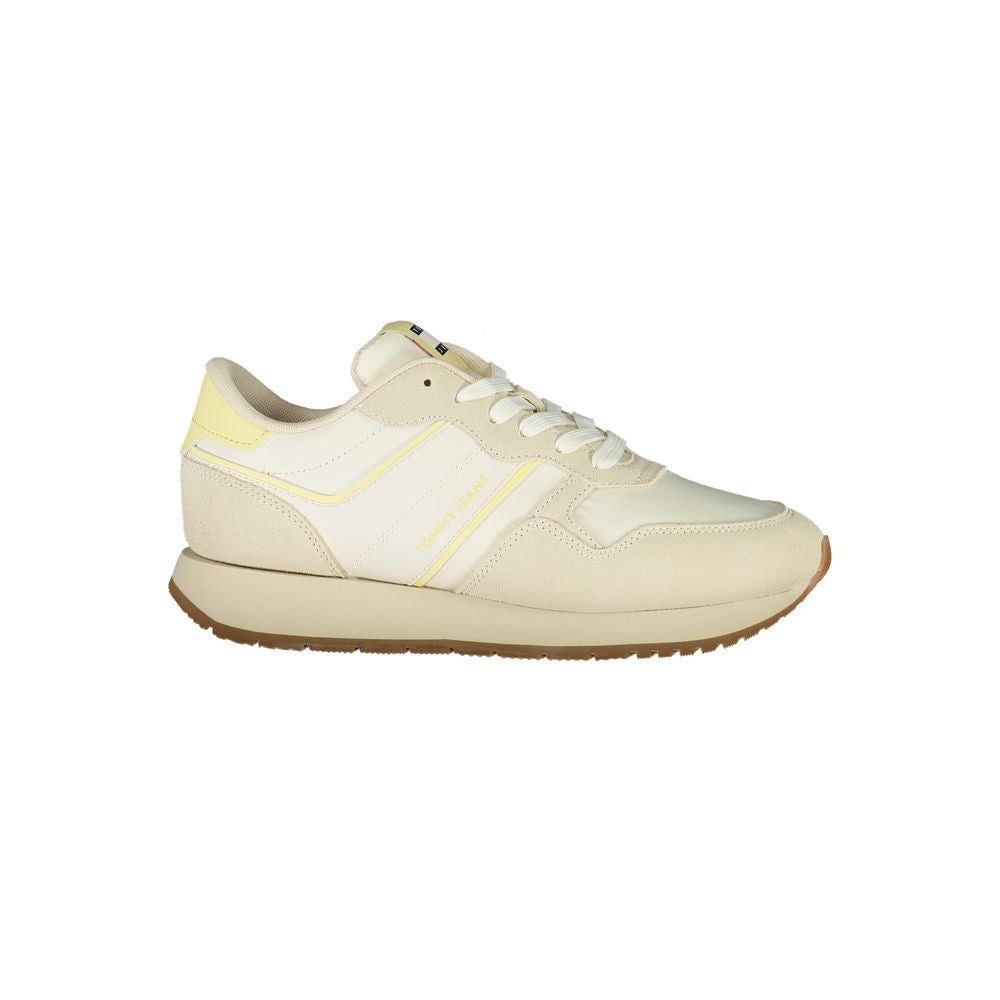 Tommy Hilfiger beige polyurethane women’s sneaker with white sole and classic logo details.