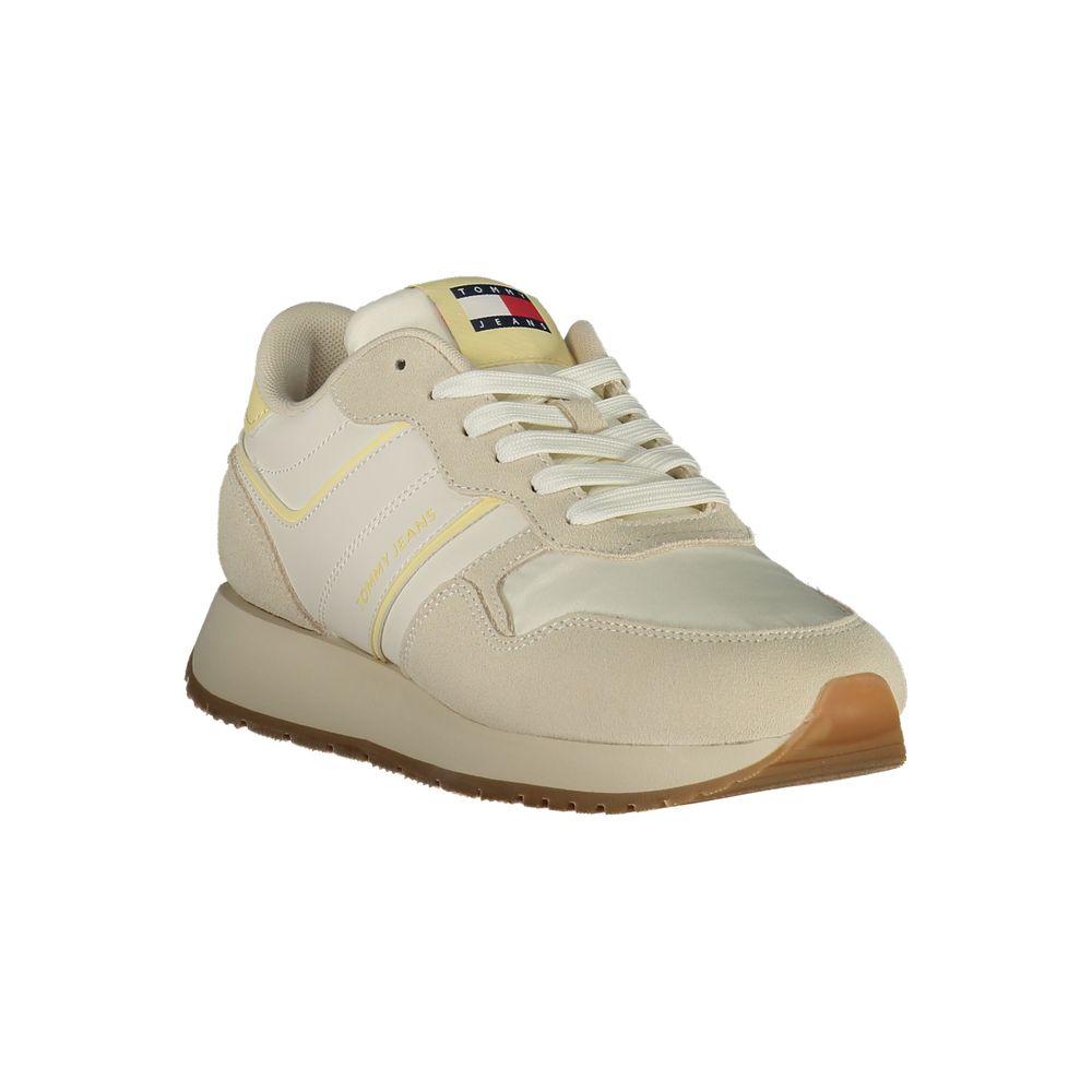 Tommy Hilfiger beige polyurethane women's sneaker with white sole and subtle branding, casual and stylish footwear.