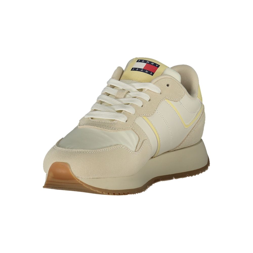 Beige Tommy Hilfiger women's sneaker made of polyurethane with white sole and subtle branding details.