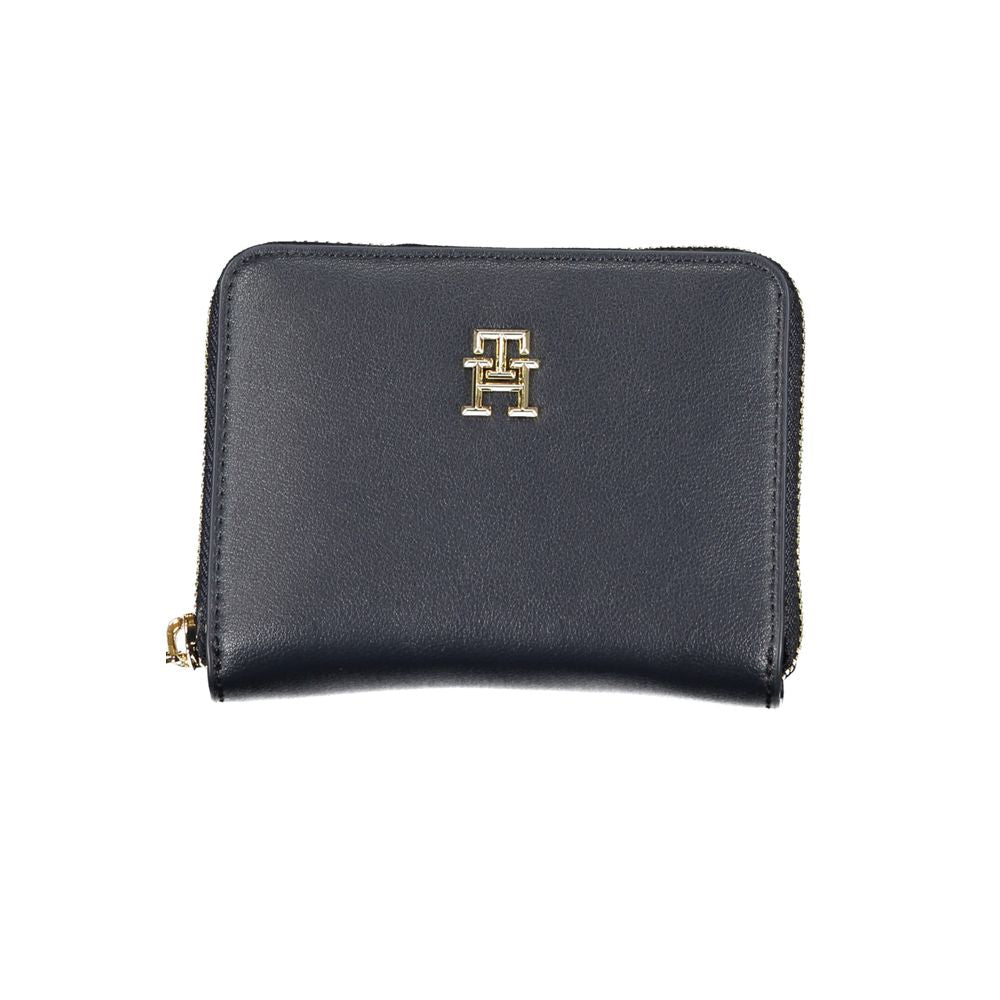 Tommy Hilfiger blue polyurethane women’s wallet with card slots and sleek design, featuring the brand logo.
