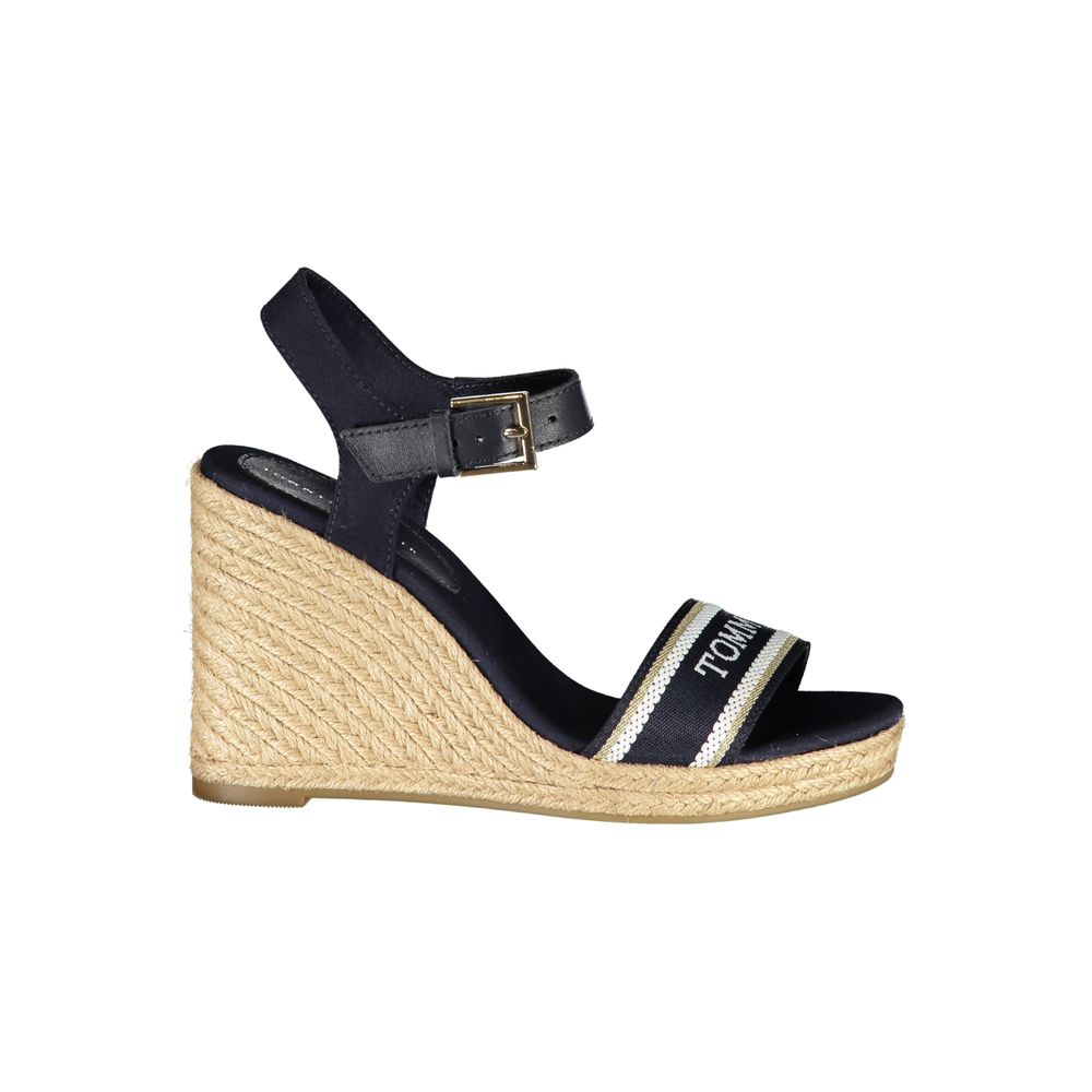 Tommy Hilfiger blue leather women's wedge sandal with ankle strap and open toe, stylish summer footwear.