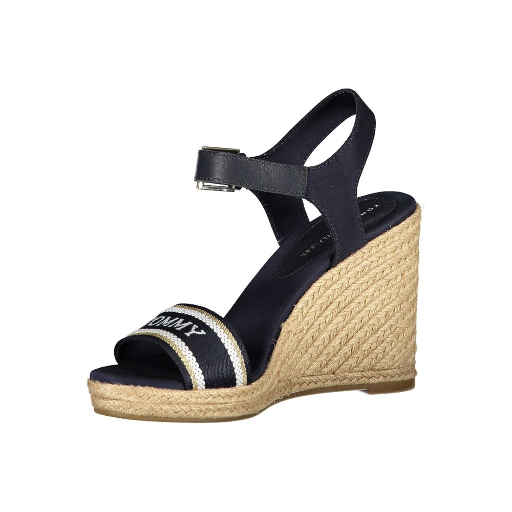 Tommy Hilfiger blue leather women's wedge sandal with ankle strap and open toe, stylish summer footwear.