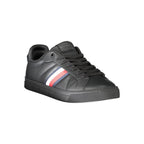 Black leather men's sneaker by Tommy Hilfiger with white sole and logo detail, shown from a side view.