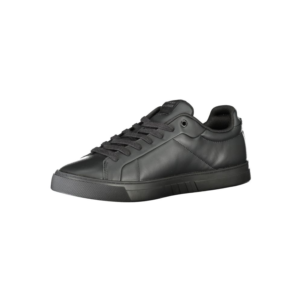 Black leather men's sneaker by Tommy Hilfiger with white sole and sleek design, featuring the brand's logo on the side.