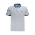 Timberland blue cotton men's polo shirt displayed on a hanger, featuring a classic collar and short sleeves.