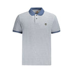 Timberland blue cotton men's polo shirt displayed on a hanger, featuring a classic collar and short sleeves.