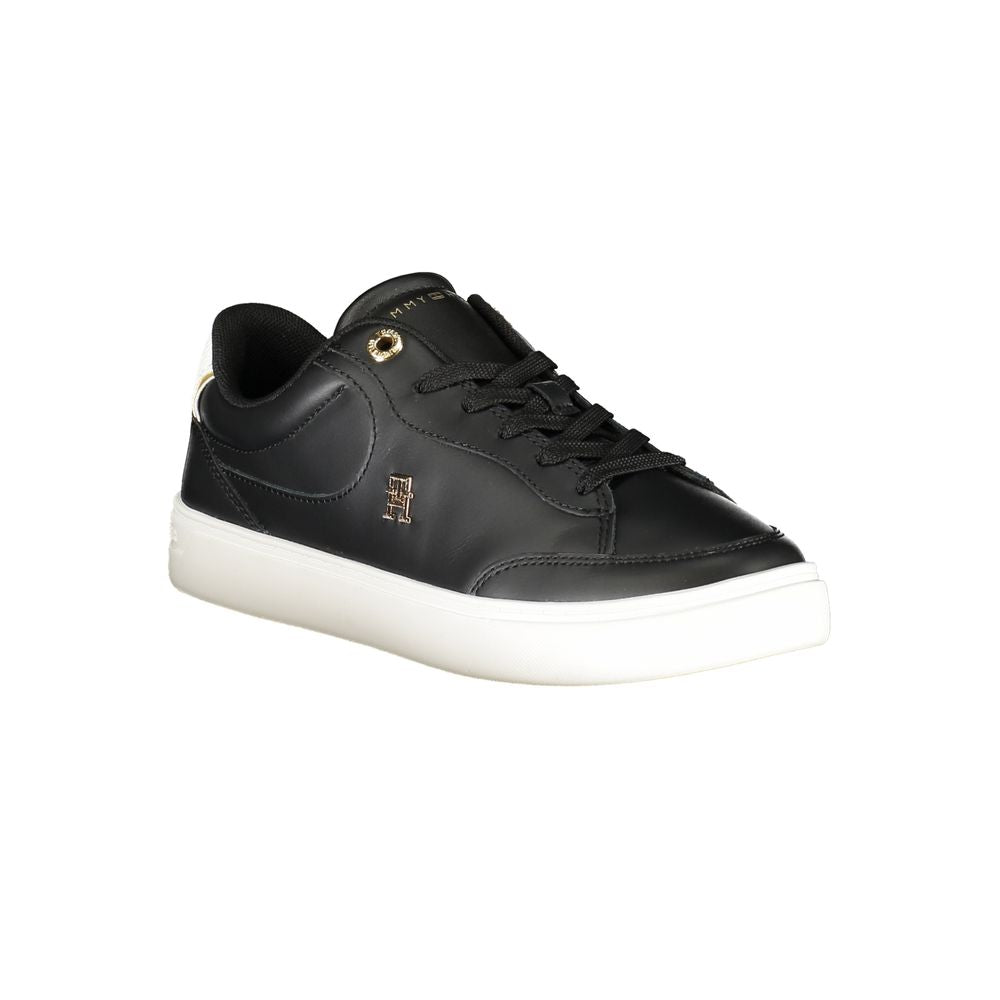 Tommy Hilfiger black polyurethane women’s sneaker with sporty design and white accents, casual athletic footwear.