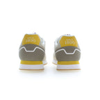 Beige polyester men's sneaker by U.S. POLO ASSN. with white sole and laces, casual athletic style, and brand logo on the side.
