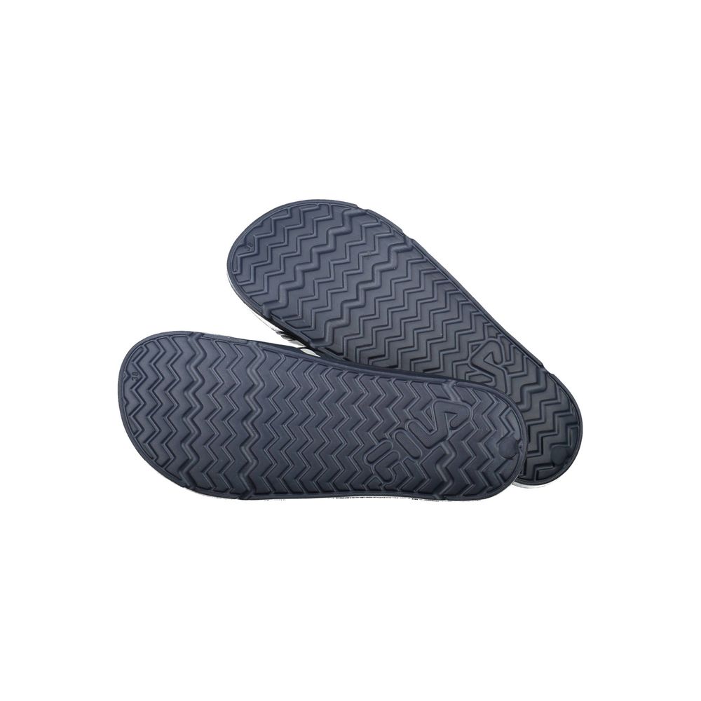 Fila blue polyurethane women's slippers shown on a model, featuring a comfortable slip-on design and casual style.