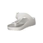 White plastic women's ciabatta shoes by Norway 1963 with a casual slip-on design and textured sole.