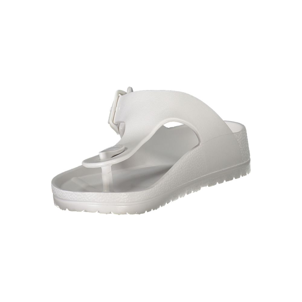 White plastic women's ciabatta shoes by Norway 1963 with a casual slip-on design and textured sole.