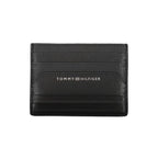 Black leather men's wallet by Tommy Hilfiger, featuring a sleek design with brand logo and multiple card slots.