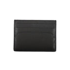 Tommy Hilfiger black leather men's wallet with multiple card slots and a sleek design.