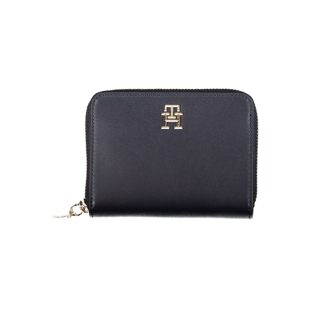 Tommy Hilfiger blue polyurethane women’s wallet with gold-tone zipper and logo detailing, compact and stylish accessory.