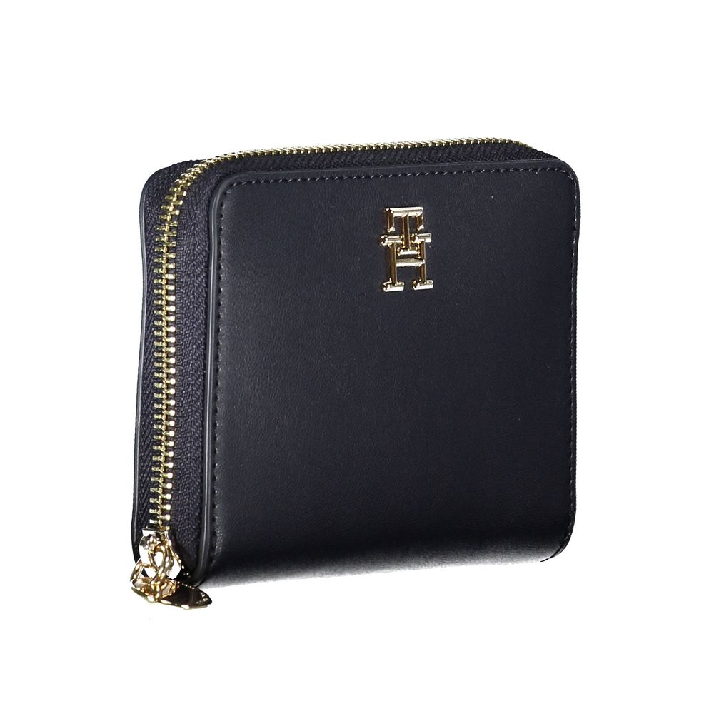 Tommy Hilfiger blue women's wallet made of polyurethane with a sleek design and branded logo on the front.