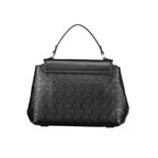 Black Calvin Klein polyester women's handbag with sleek design and top handle, featuring subtle branding and zipper closure.