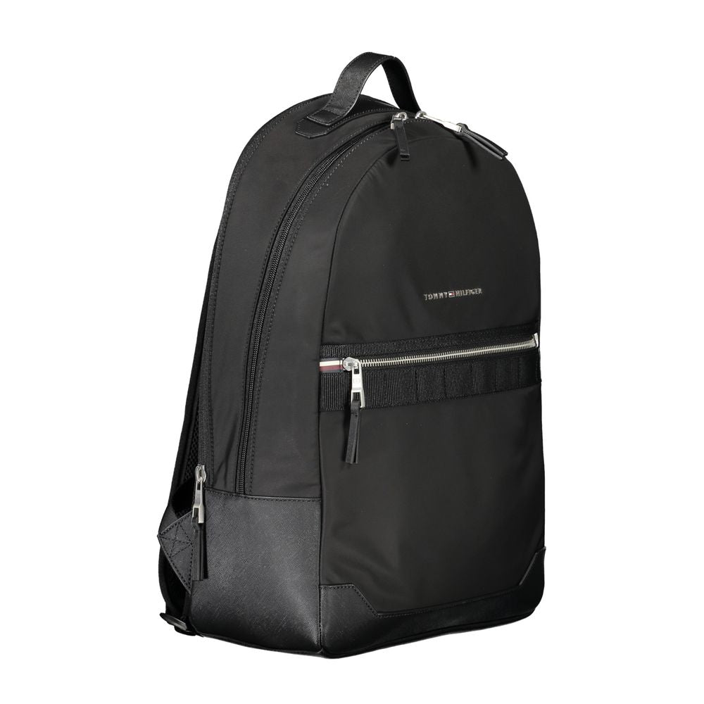 Tommy Hilfiger black polyester men's backpack with multiple compartments and adjustable straps, stylish and practical for everyday use.