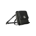 Black polyester Calvin Klein women's handbag with sleek design and subtle logo detailing.