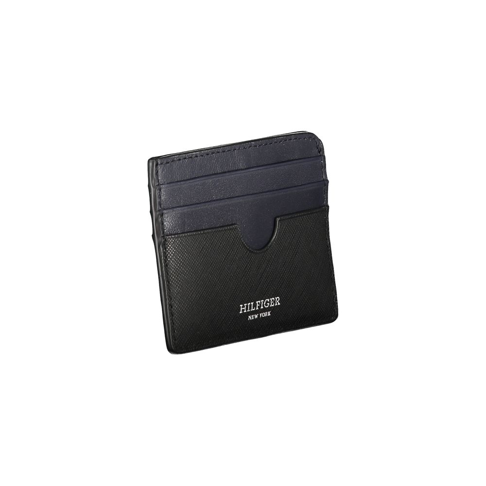 Tommy Hilfiger black leather men's wallet with embossed logo and multiple card slots, displayed open showing interior compartments.