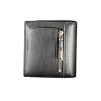 Calvin Klein black polyurethane women's wallet with sleek design and multiple card slots, front logo detail, and compact style.