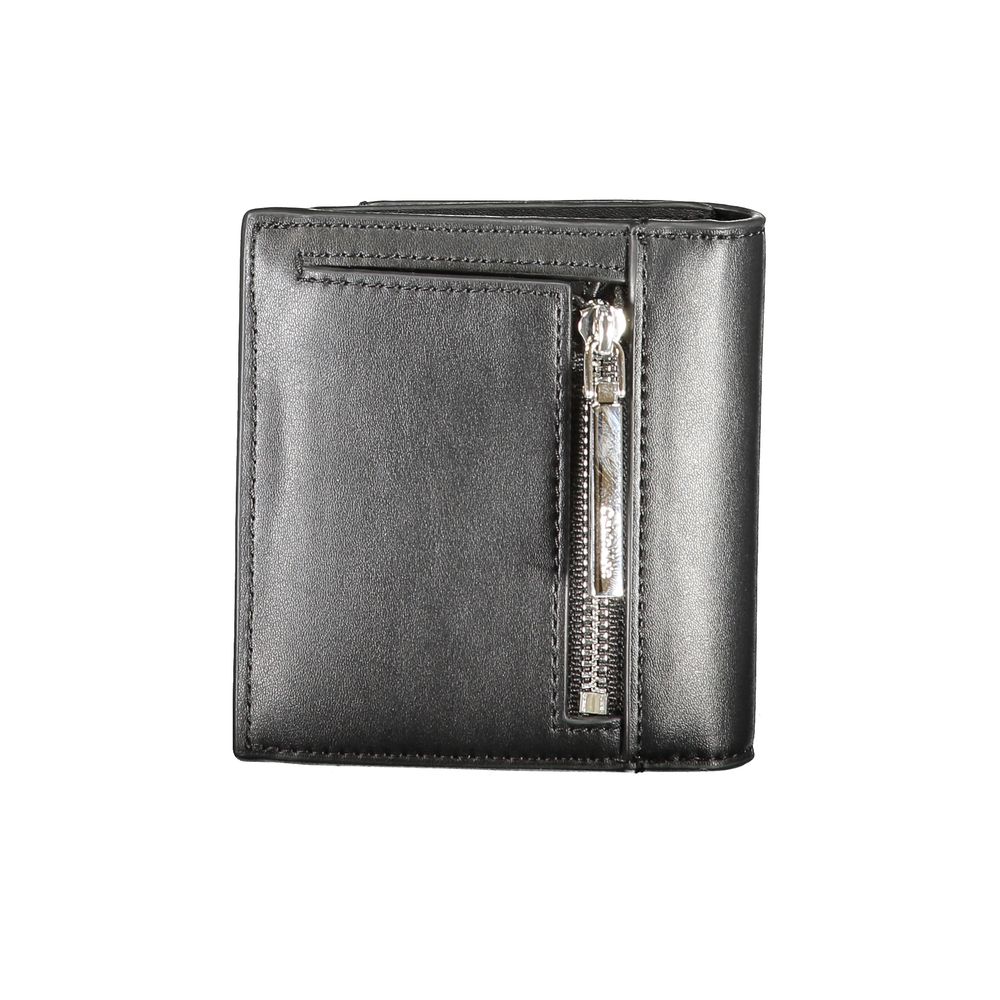 Calvin Klein black polyurethane women's wallet with sleek design and multiple card slots, front logo detail, and compact style.