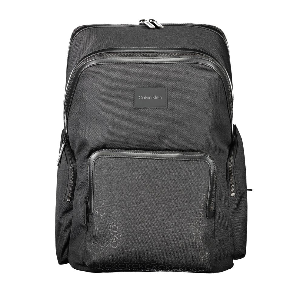 Black polyester men's backpack by Calvin Klein with adjustable straps and multiple compartments.