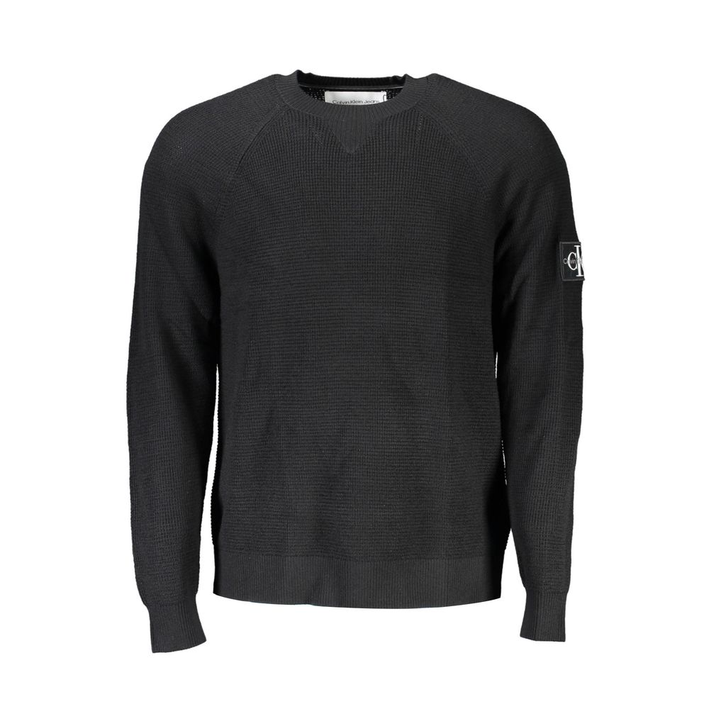 Calvin Klein Nero wool men's sweater displayed on a mannequin, featuring a classic crew neck and ribbed cuffs.