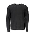 Calvin Klein Nero wool men's sweater displayed on a mannequin, featuring a classic crew neck and ribbed cuffs.