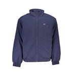 Tommy Hilfiger blue polyamide men's jacket displayed on a hanger, featuring a zip front and logo detail.