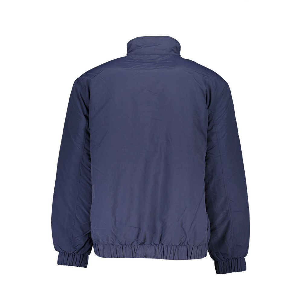 Tommy Hilfiger blue polyamide men's jacket displayed on a hanger, showcasing its sleek design and lightweight material.