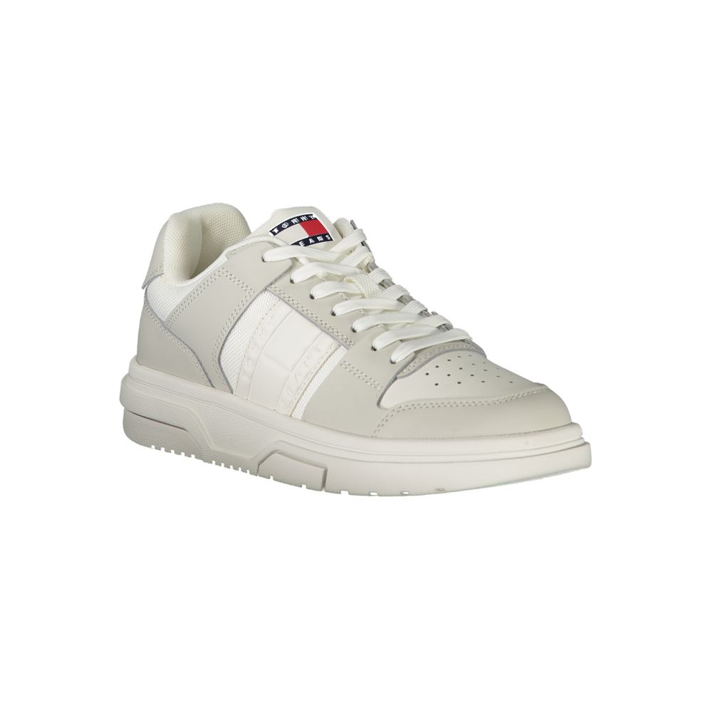 White leather women's sneaker by Tommy Hilfiger with Nike-style design, featuring sporty laces and a sleek casual look.